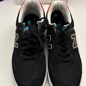 New Balance Black Sneakers with Gold Accents
